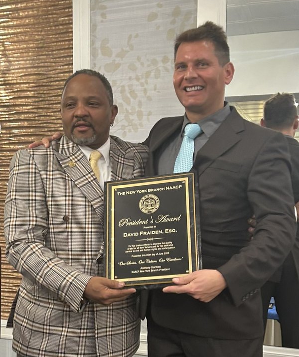 Marshal David Fraiden receiving the New York Branch NAACP President's Award from branch president Anthony Harmon, June 2025